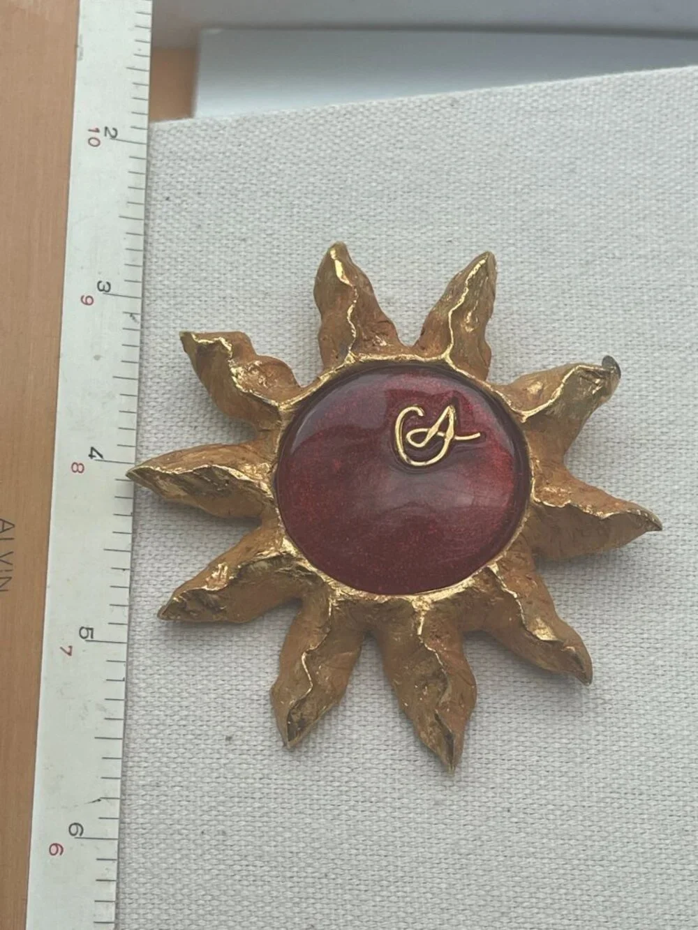 Christian Lacroix Gold-Tone Sun Brooch W/ Red Resin Center & Golden Logo